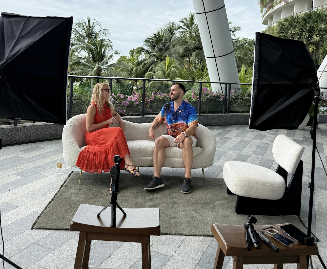 Jake in conversation with a podcast host on an outdoor recording set